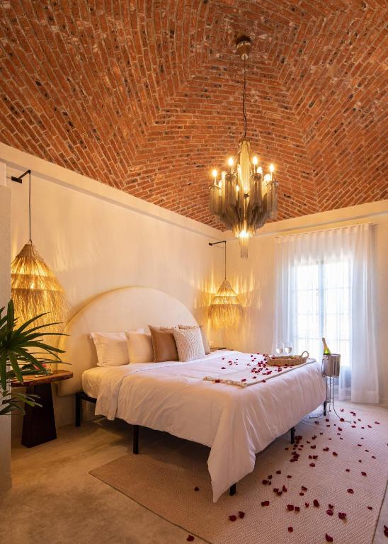 Postel nebo postele na pokoji v ubytování HOLT Hotel del Pueblito
