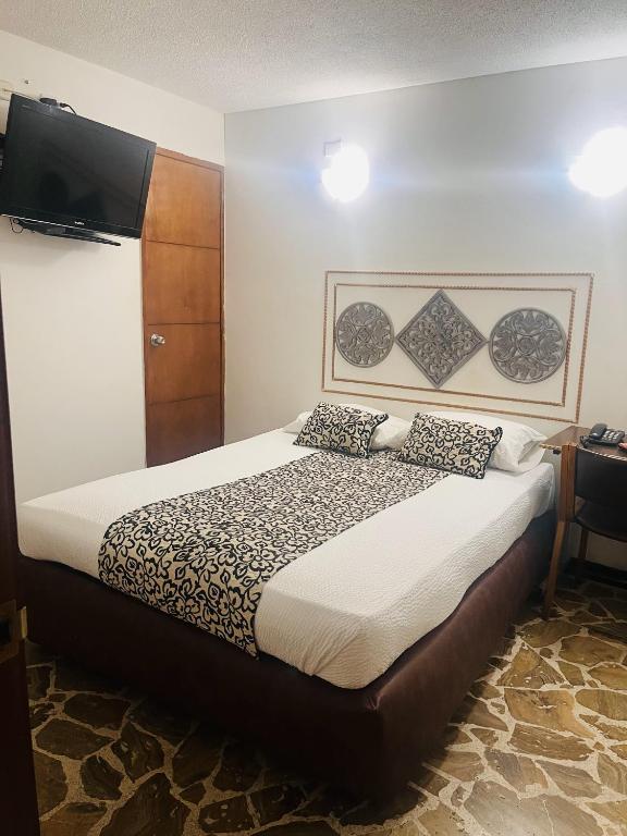 Postel nebo postele na pokoji v ubytování Hotel Zandu