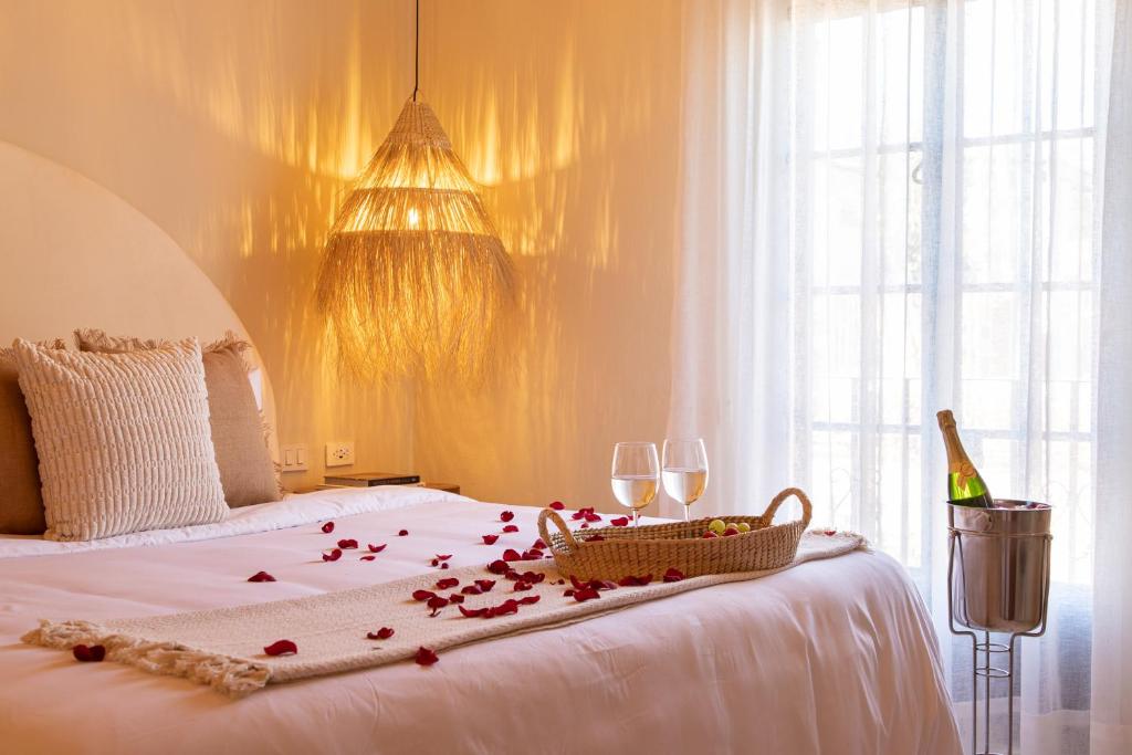 Postel nebo postele na pokoji v ubytování HOLT Hotel del Pueblito