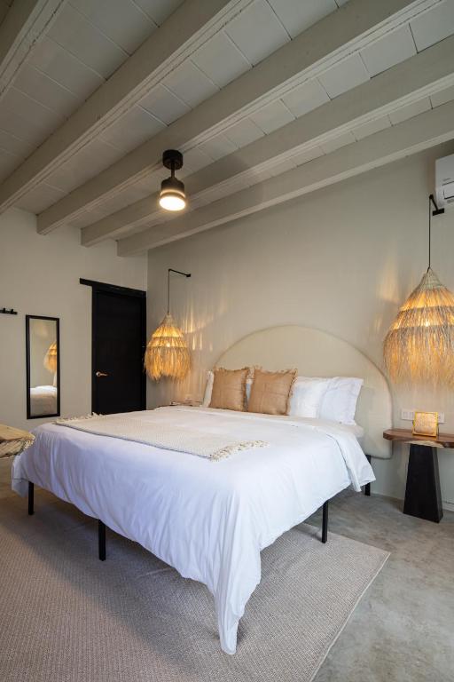 Postel nebo postele na pokoji v ubytování HOLT Hotel del Pueblito