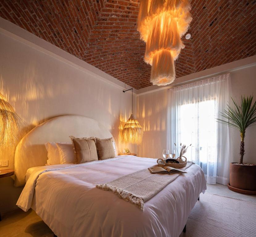 Postel nebo postele na pokoji v ubytování HOLT Hotel del Pueblito