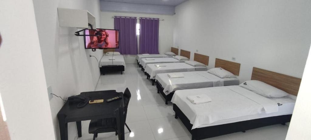 Postel nebo postele na pokoji v ubytování Hotel Resende
