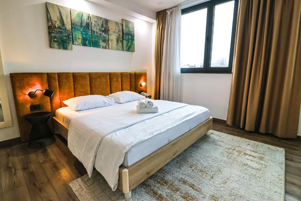 Łóżko lub łóżka w pokoju w obiekcie Hotel National