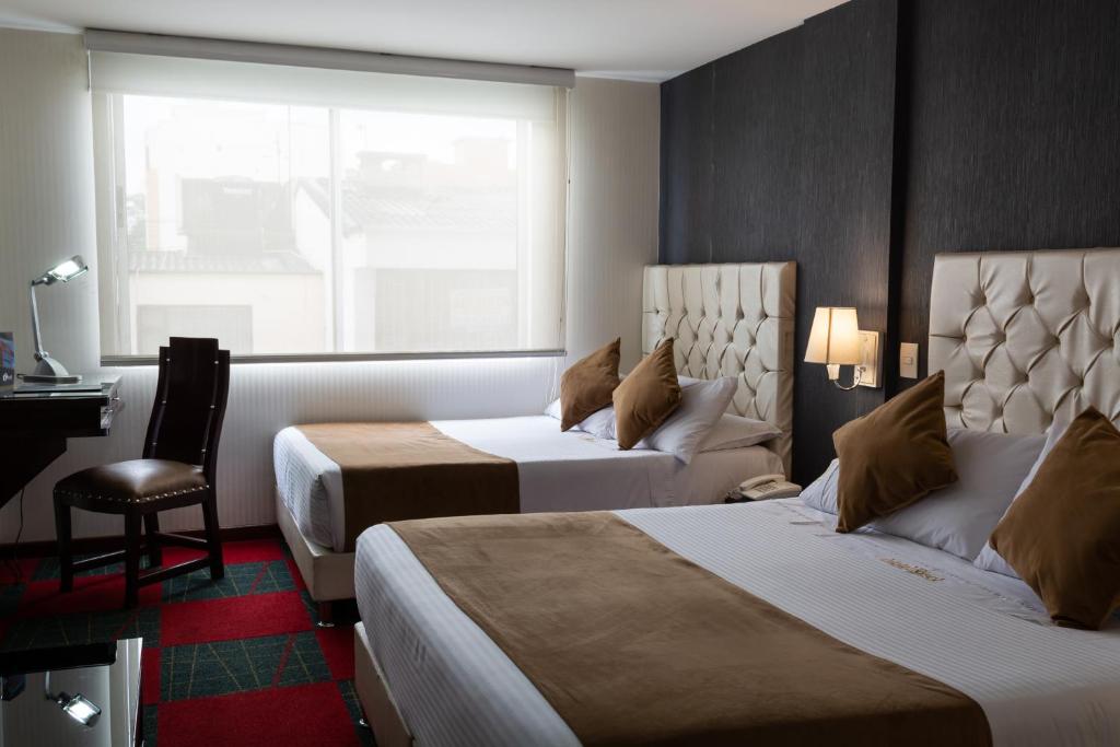 Postel nebo postele na pokoji v ubytování Hotel Risot