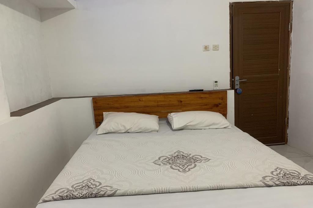 Un pat sau paturi într-o cameră la Mozza guest house