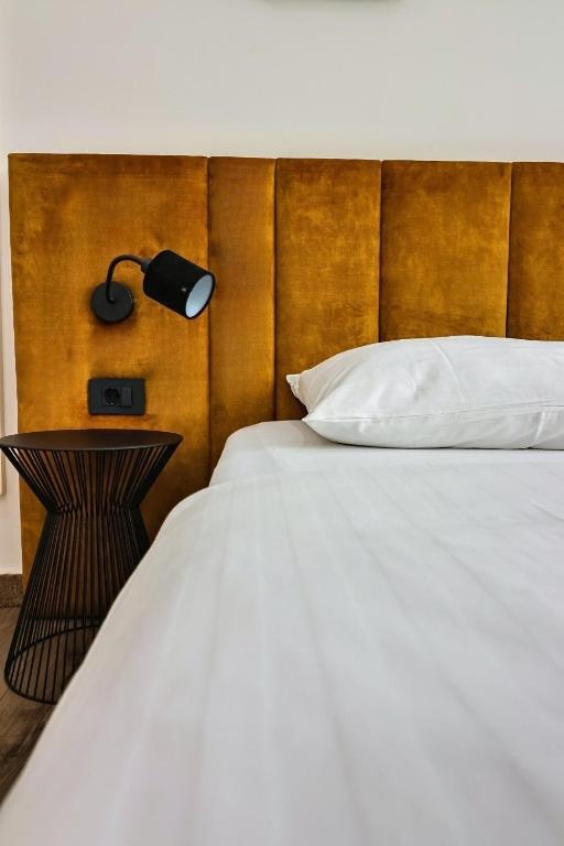 Łóżko lub łóżka w pokoju w obiekcie Hotel National