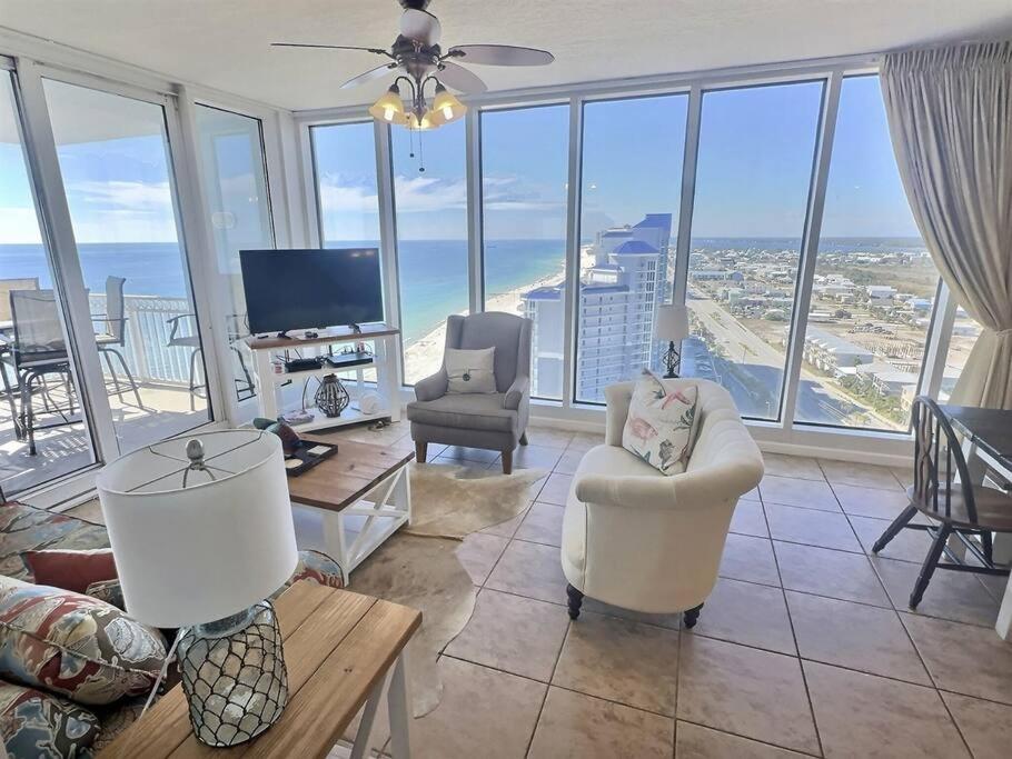 a living room with a view of the ocean at 4 Bedroom Luxury High Rise Corner Condo with 2 Balconies, Heated Pool, Direct Beach Access in Gulf Shores