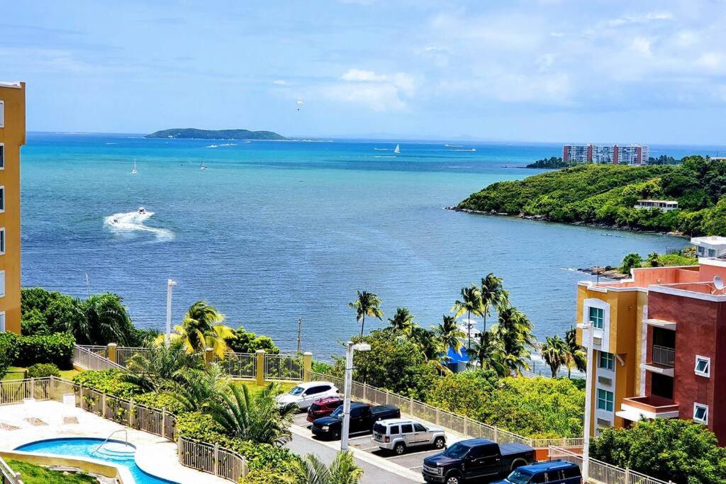 a view of the ocean with a boat in the water at Adjust Your Latitude - Amazing Sea & Marina Views in Fajardo