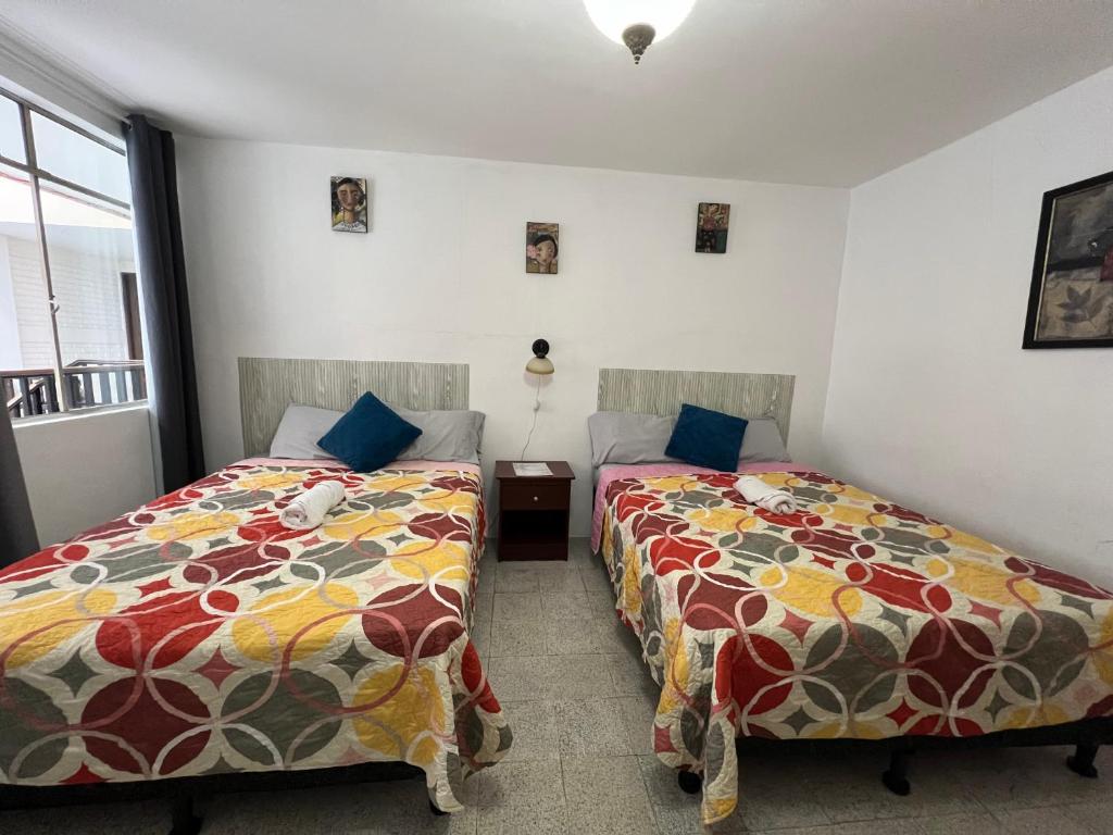 Postel nebo postele na pokoji v ubytování Casa Xibalba
