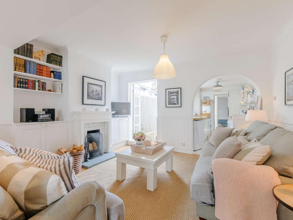 a living room with two couches and a fireplace at 3 Bed in Whitstable WCC20 in Whitstable