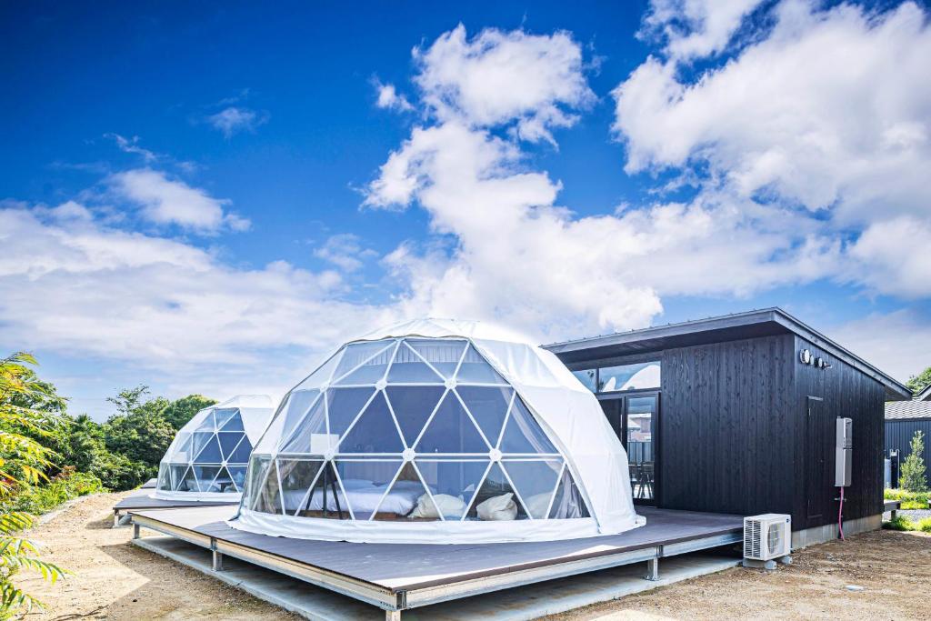 an igloo house with two domes on a platform at THE GLAMPING PLAZA 伊勢志摩BASE in Ugata