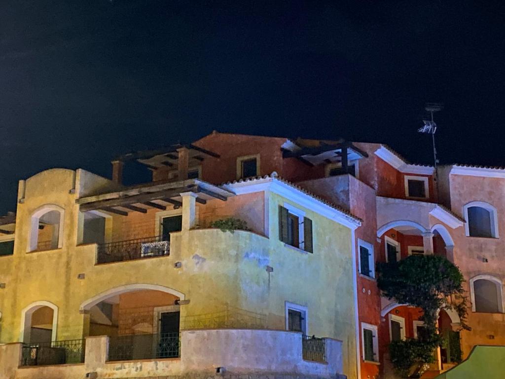 a group of buildings at night at Casa Ginevra in Santa Teresa Gallura