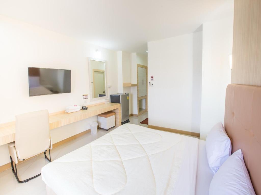 Postel nebo postele na pokoji v ubytování P.A. Thani Hotel