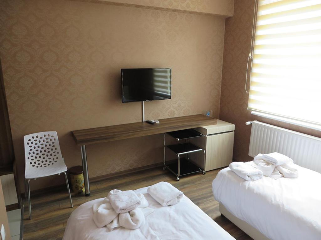 Postel nebo postele na pokoji v ubytování Hotel Dunav
