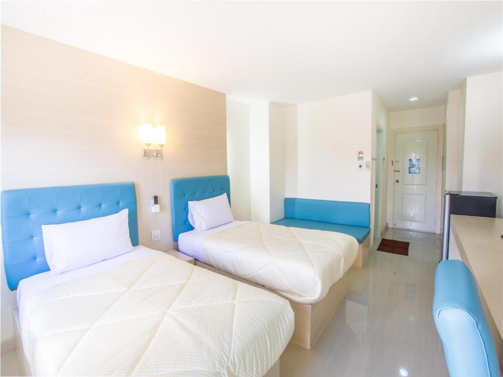 Postel nebo postele na pokoji v ubytování P.A. Thani Hotel