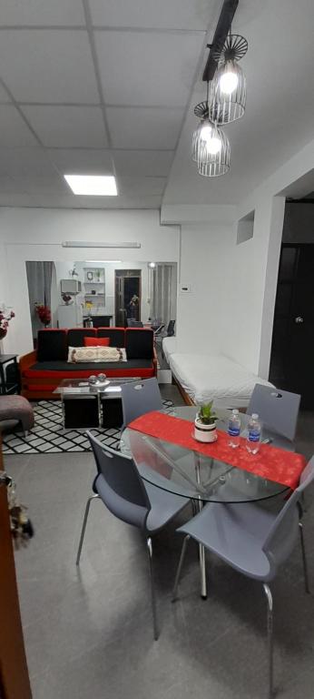 a living room with a glass table and chairs at Casablanca 4 in Tacna