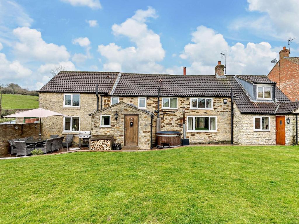 a large stone house with a large yard at 4 Bed in York G0091 