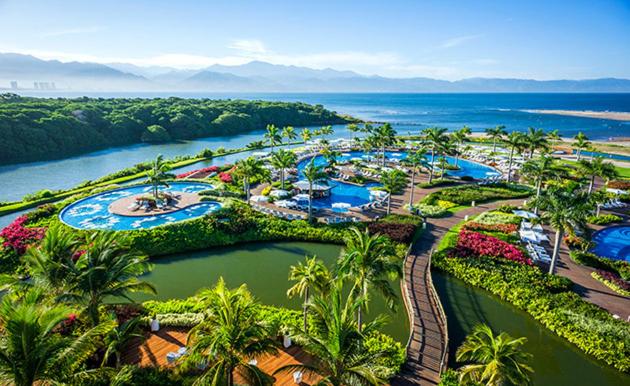 an aerial view of a resort near the water at Vidanta Grand Luxxe 3 BR Loft 16 rounds of Golf tennis 2 Massages included in Nuevo Vallarta 