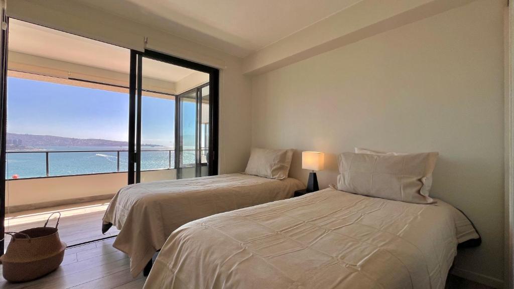 En eller flere senge i et værelse på Lo Mejor Viña del Mar