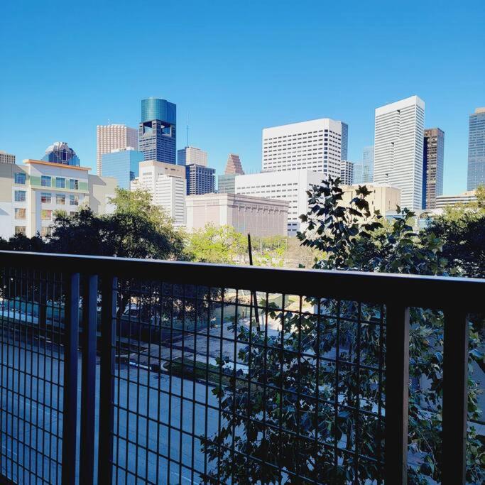 a view of a city skyline from a balcony at Downtown Dream Toyota Ctr/George R Brown/Minute Maid Stadium in Houston