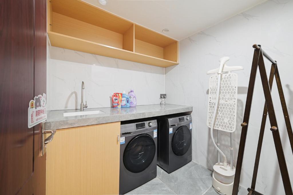 Kuchyň nebo kuchyňský kout v ubytování East Maple International Apartment - Guangzhou Luogang Wanda Plaza Suyuan Metro Station