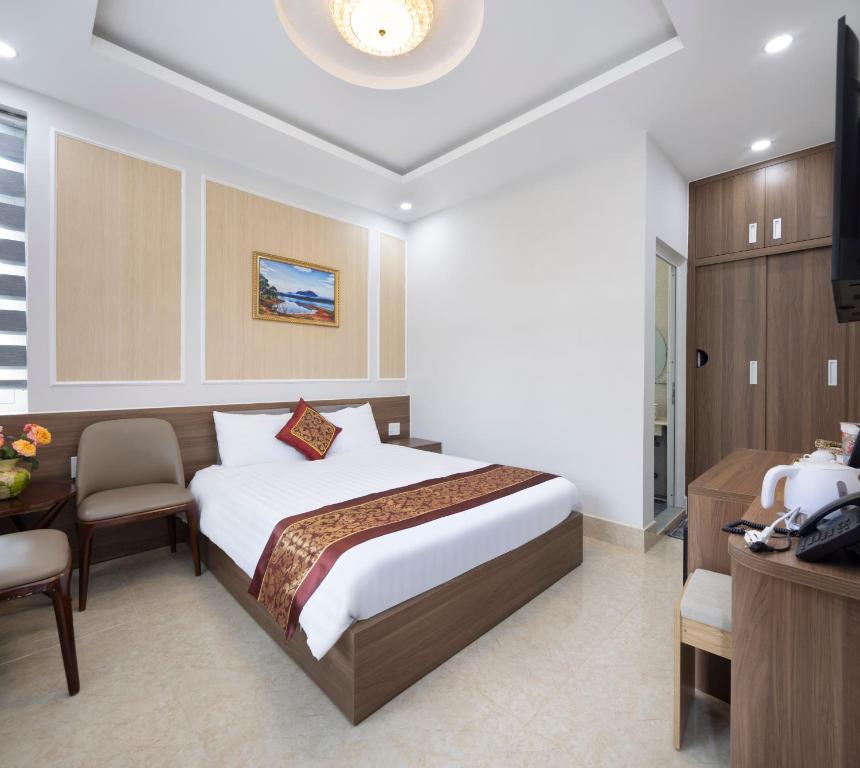 Postel nebo postele na pokoji v ubytování ROMANCE HOTEL DALAT