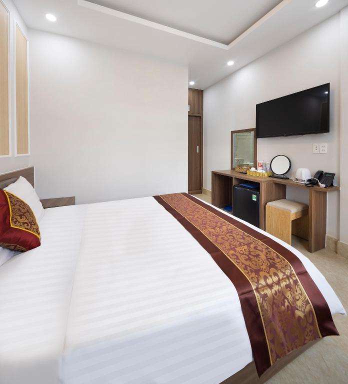 Postel nebo postele na pokoji v ubytování ROMANCE HOTEL DALAT