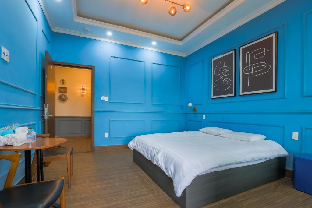 Postel nebo postele na pokoji v ubytování AN PHÚ Home