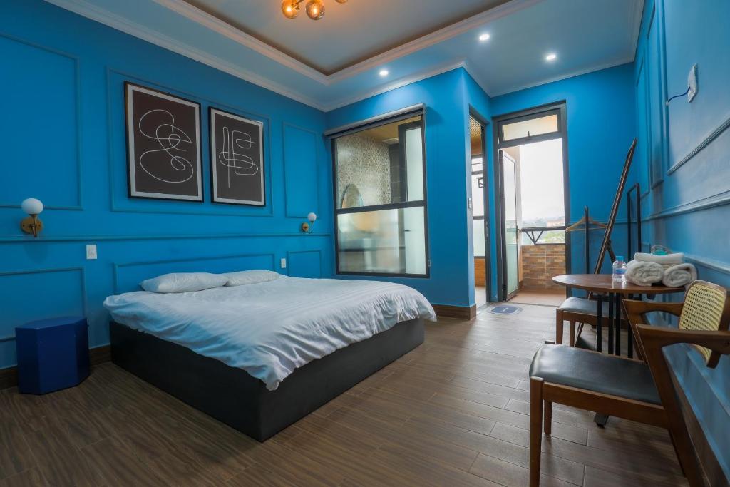 Postel nebo postele na pokoji v ubytování AN PHÚ Home