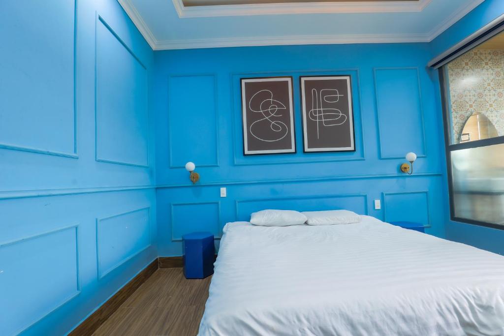 Postel nebo postele na pokoji v ubytování AN PHÚ Home