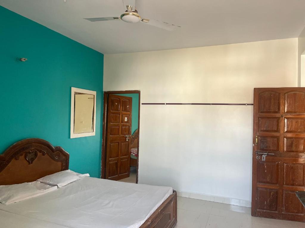 Postel nebo postele na pokoji v ubytování Hotel Raghunath Residency Niwas