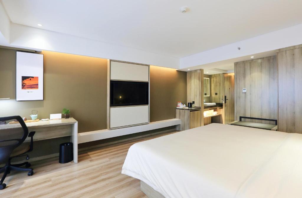 TV a/nebo společenská místnost v ubytování Atour Hotel Xi'an Xixian Vientiane City