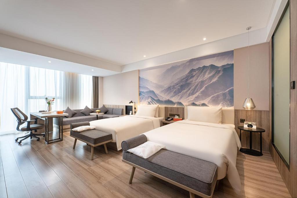 Postel nebo postele na pokoji v ubytování Atour Hotel Xi'an Daming Palace