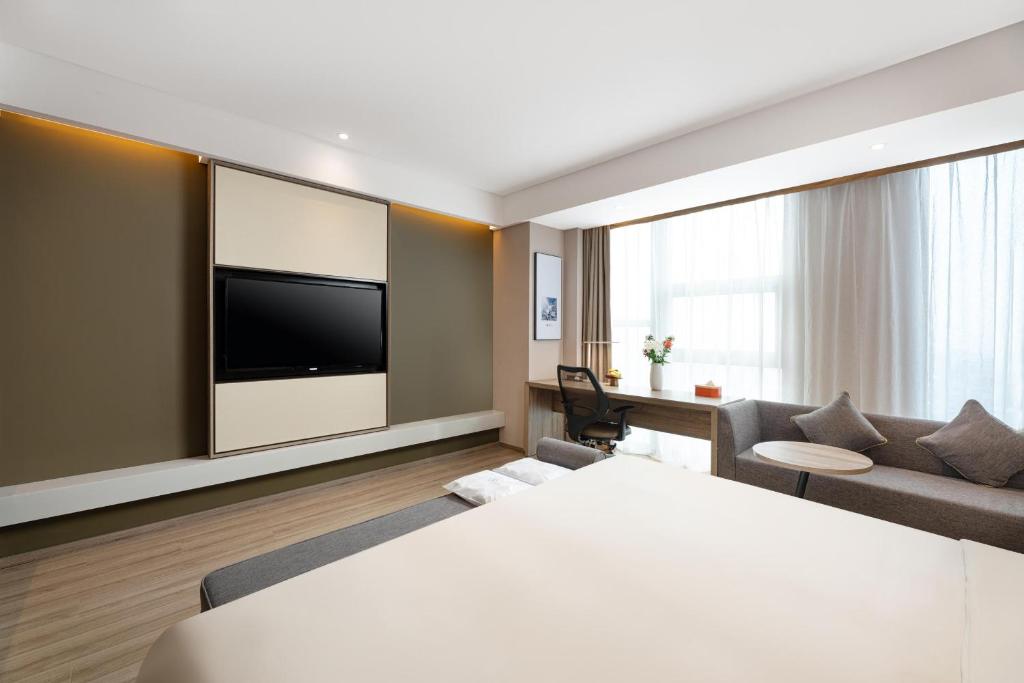 TV a/nebo společenská místnost v ubytování Atour Hotel Xi'an Daming Palace