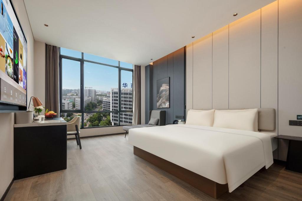 Postel nebo postele na pokoji v ubytování Atour Hotel Foshan Chancheng Zhangcha