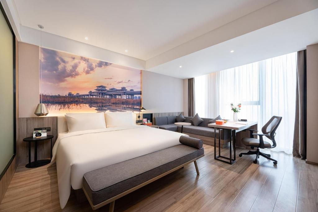 Postel nebo postele na pokoji v ubytování Atour Hotel Xi'an Daming Palace