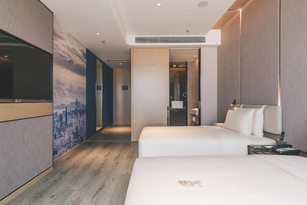 TV a/nebo společenská místnost v ubytování Atour Hotel Shenzhen Luohu Shuibei IBC