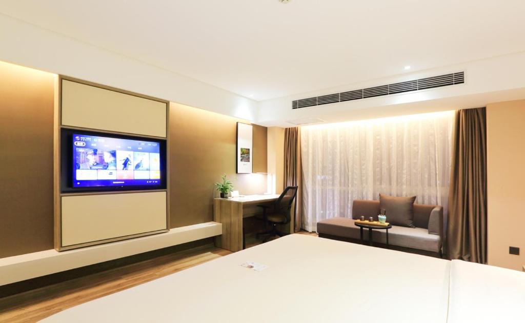 TV a/nebo společenská místnost v ubytování Atour Hotel Xi'an Xixian Vientiane City