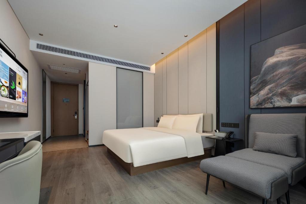TV a/nebo společenská místnost v ubytování Atour Hotel Foshan Chancheng Zhangcha