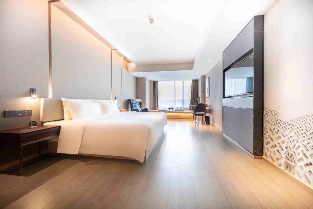 Postel nebo postele na pokoji v ubytování Atour Hotel Foshan Shunde Happy Coast
