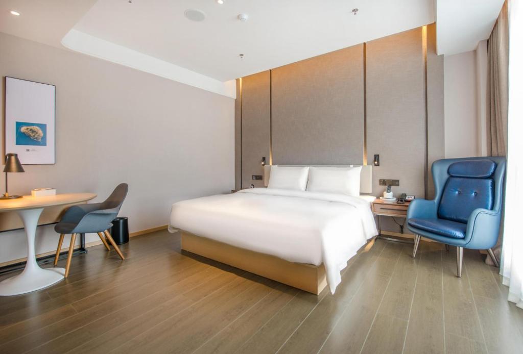 Postel nebo postele na pokoji v ubytování Atour Hotel Zhongshan Tanzhou