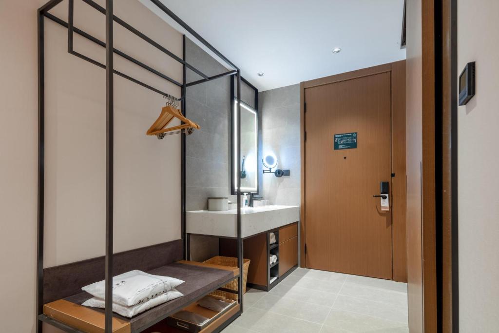Postel nebo postele na pokoji v ubytování Atour Hotel Foshan Chancheng Zhangcha