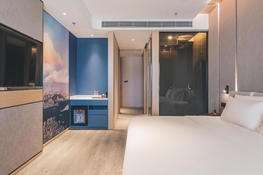 Postel nebo postele na pokoji v ubytování Atour Hotel Shenzhen Luohu Shuibei IBC