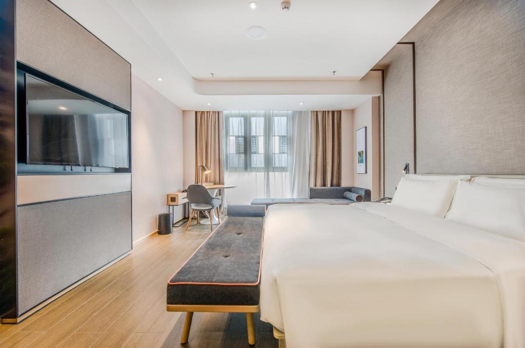 Postel nebo postele na pokoji v ubytování Atour Hotel Zhongshan Tanzhou