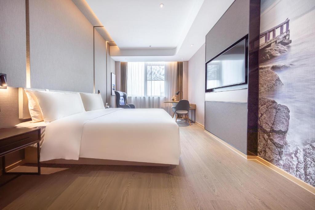 Postel nebo postele na pokoji v ubytování Atour Hotel Shenzhen Guangming New City