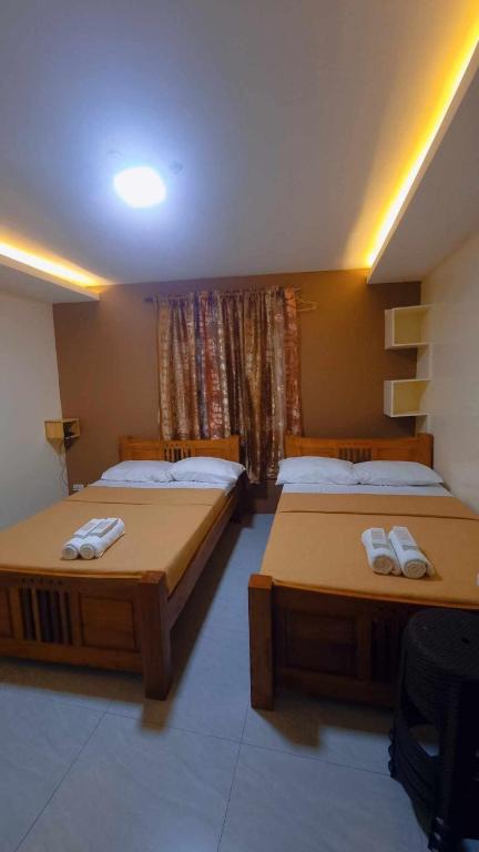Postel nebo postele na pokoji v ubytování Visita highland Inn