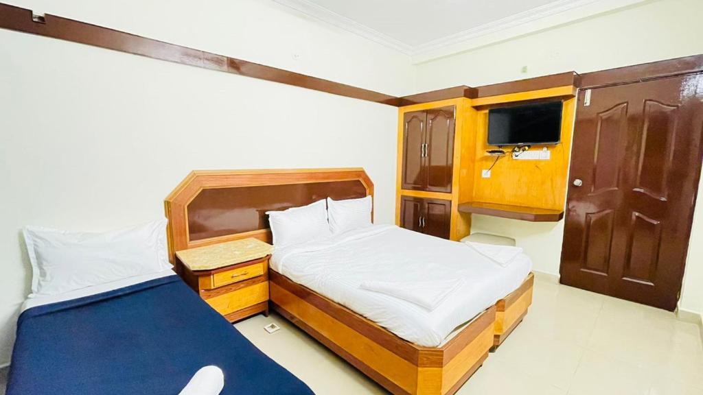 Postel nebo postele na pokoji v ubytování HALF MOON INN
