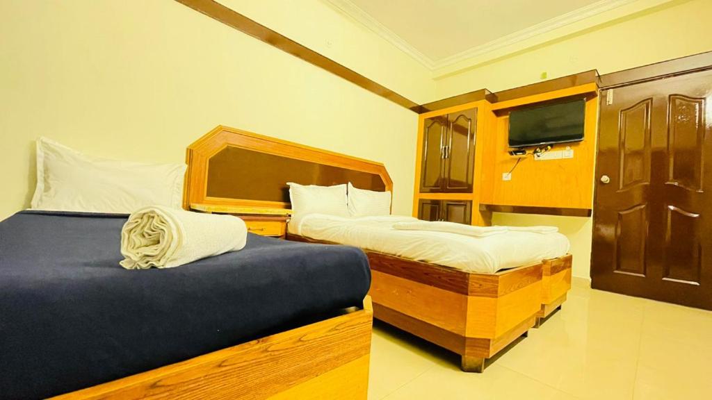 Postel nebo postele na pokoji v ubytování HALF MOON INN