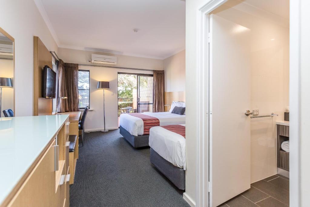 Ein Bett oder Betten in einem Zimmer der Unterkunft Country Comfort Perth