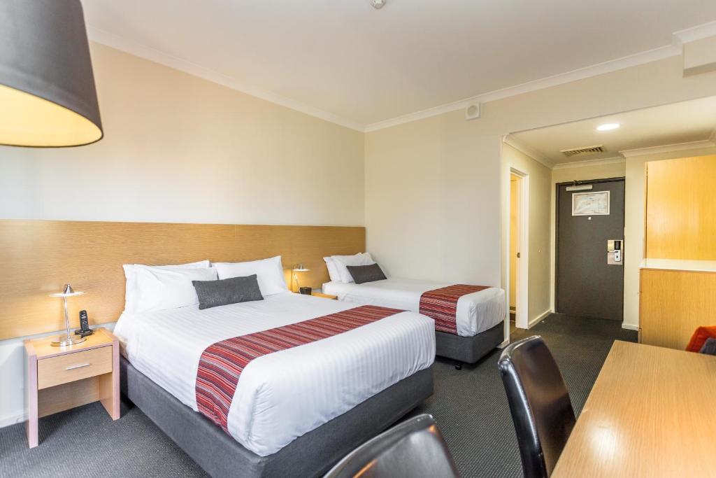 Ein Bett oder Betten in einem Zimmer der Unterkunft Country Comfort Perth